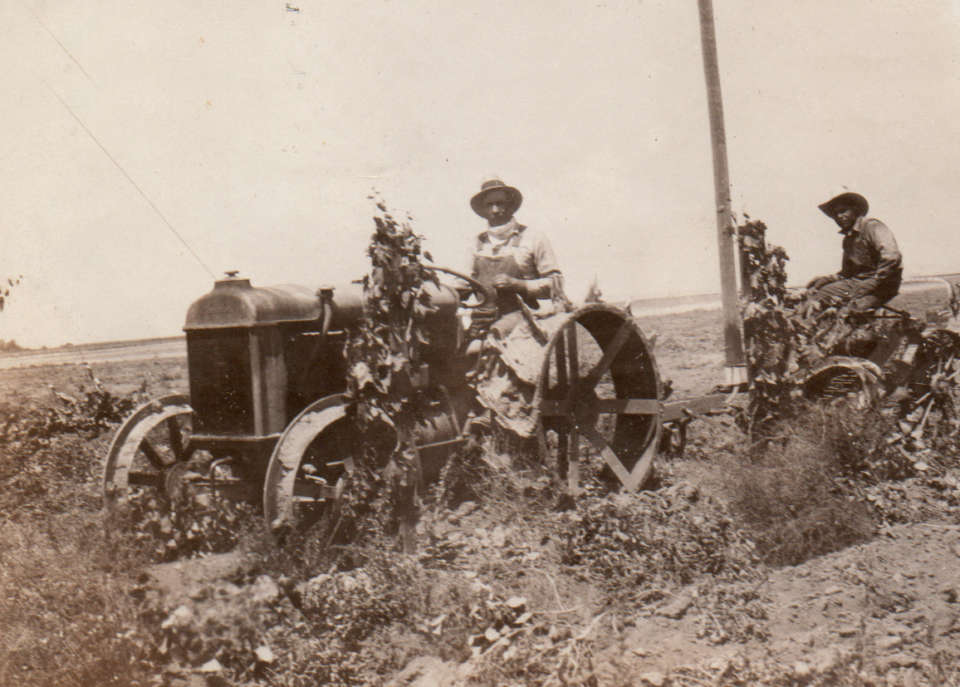 Sam & Nono on tractor 1930